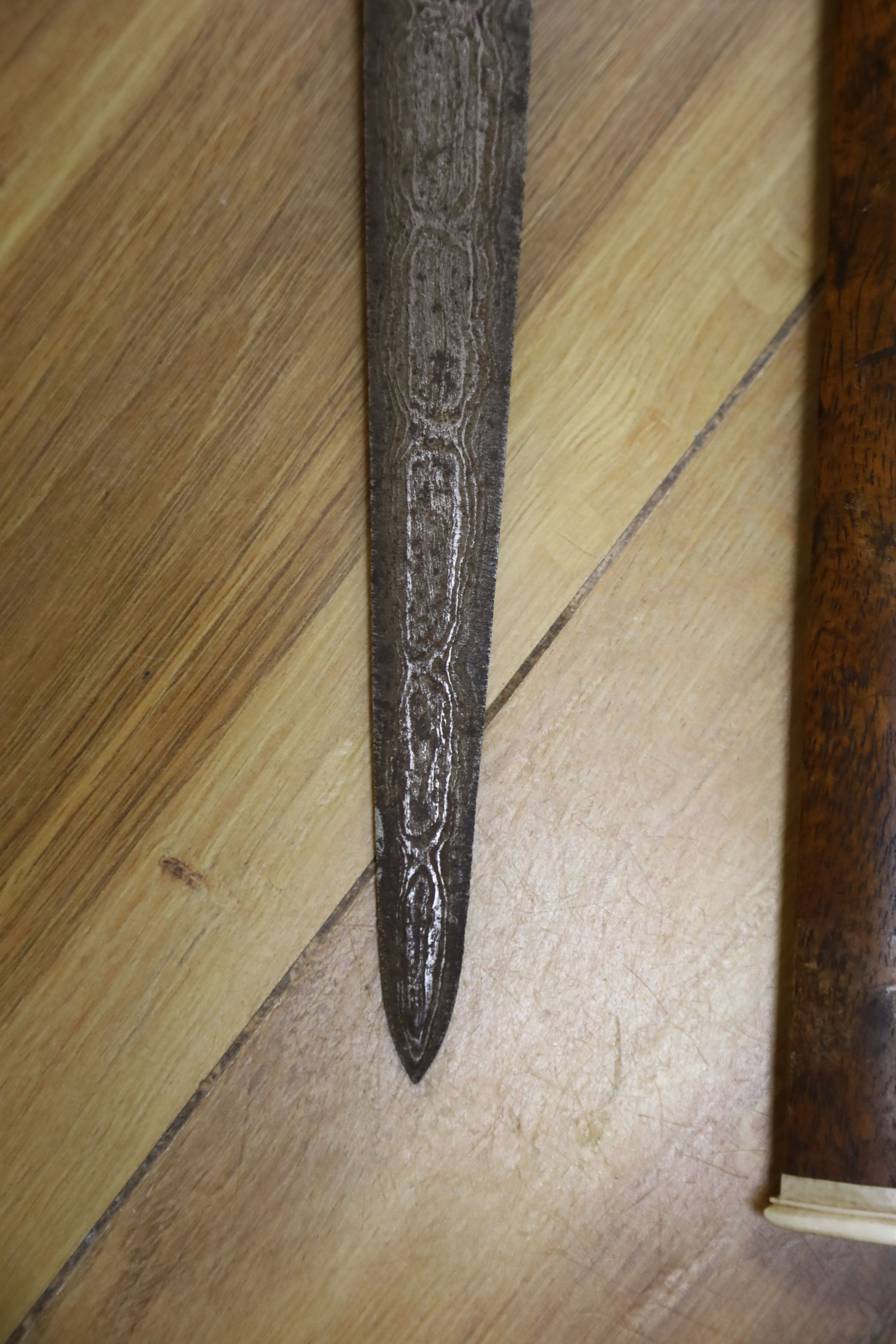 Two Eastern kris, an opium pipe, sticks, busts, etc.